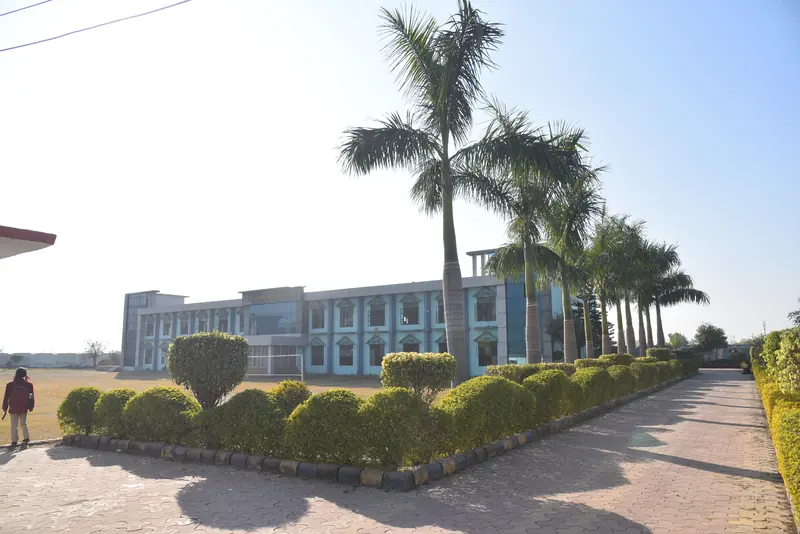 The hedge-lined path up to the school building