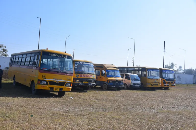 The bus fleet beside the playing ground